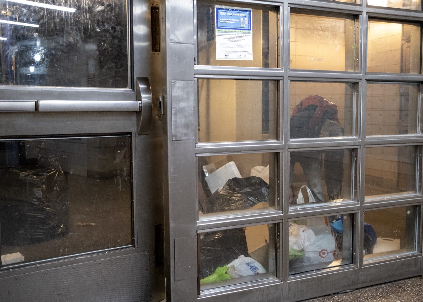 Trash in the entry way of a building in the Polo Grounds Houses in Manhattan, New York. Photo by Antonio di Caterina