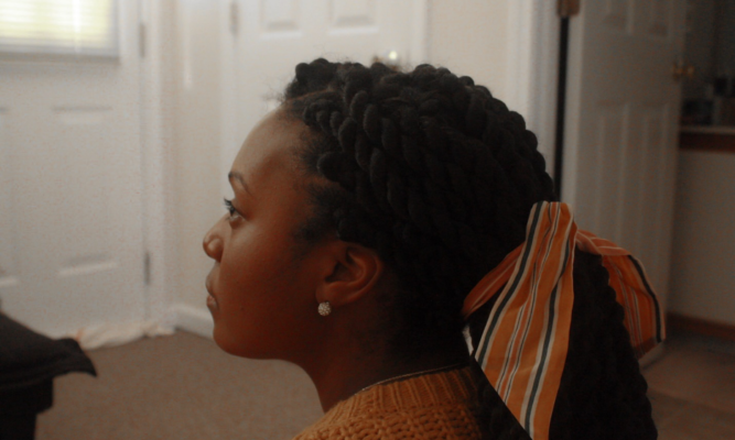 Young woman with hair pulled back.