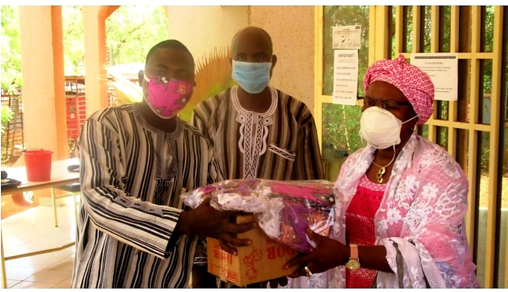 Administrators in Ouahigouya, Burkina Faso receive face masks sent by Boukary Sawadogo.