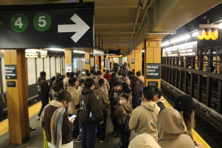 Parishioners waiting for train in the station.