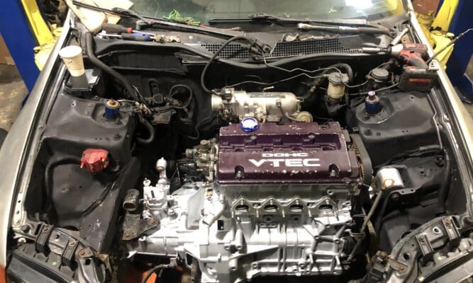 Image of an engine being fixed.