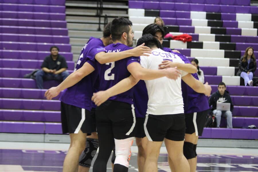 Men's Volleyball team huddles up