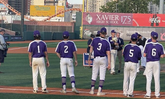 City College of New York pitcherJD Johnstone and team with the trophy