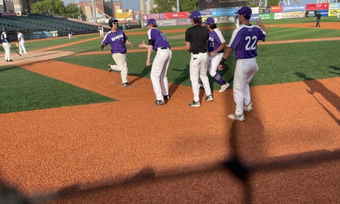 Team greets Michael Chasanov in front of dugout